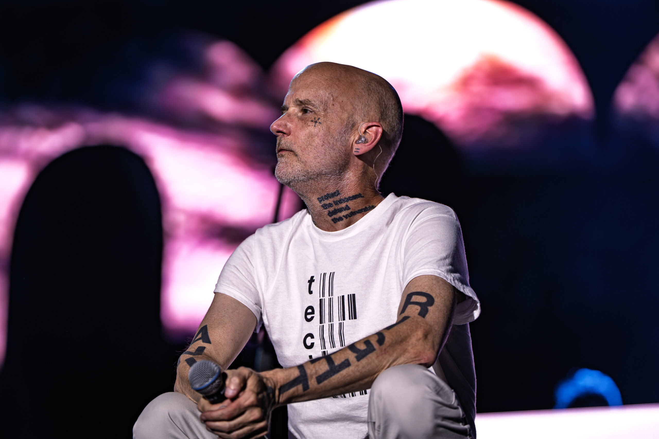 Moby sitting on stage during a quiet moment of his live performance at Release Athens Festival 2026, Athens.