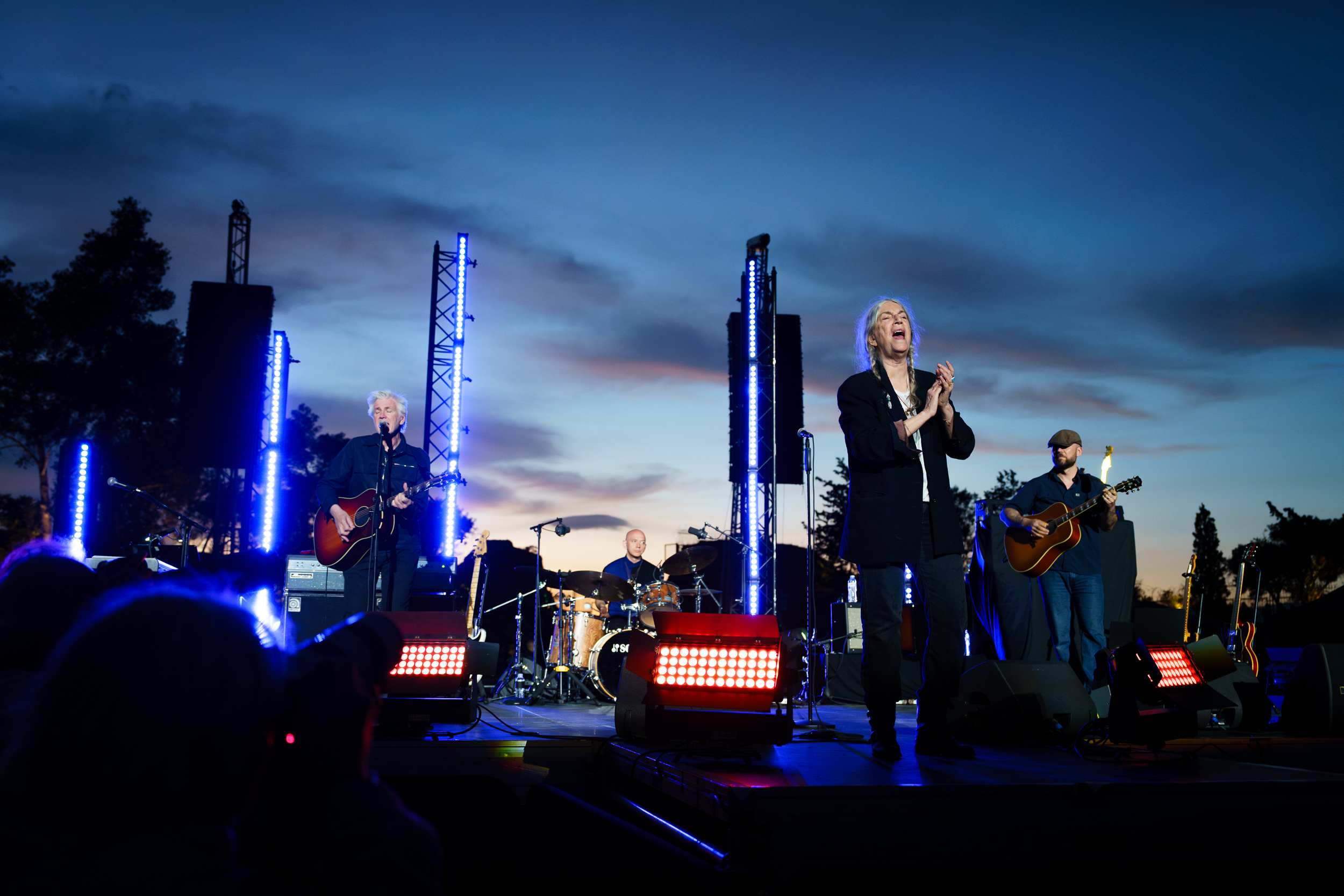 Patti Smith Quartet performing live at Lycabettus Theater in Athens at sunset, 2026