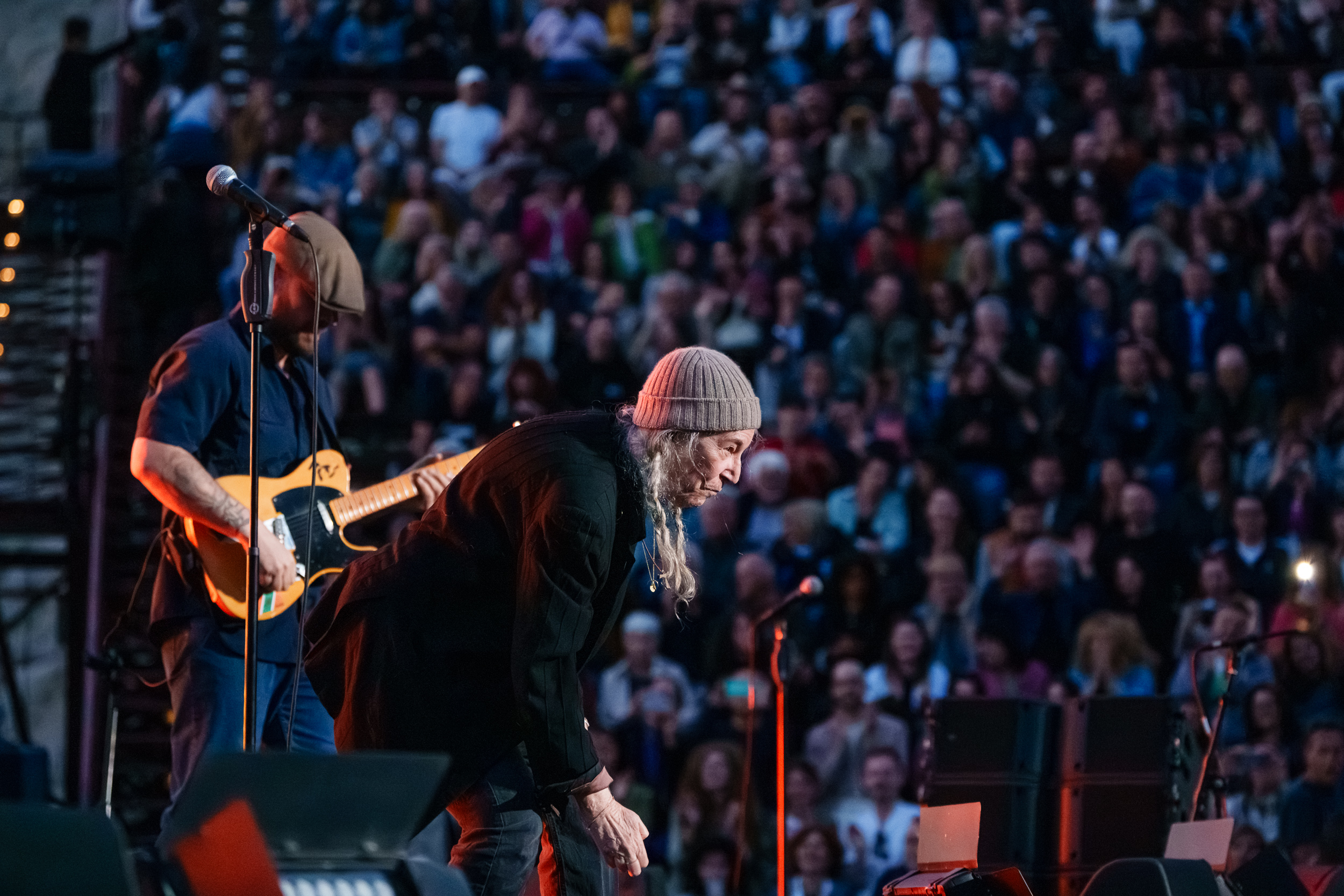 Patti Smith performing in front of the audience with guitarist Jackson Smith at Lycabettus Theater in Athens, 2026
