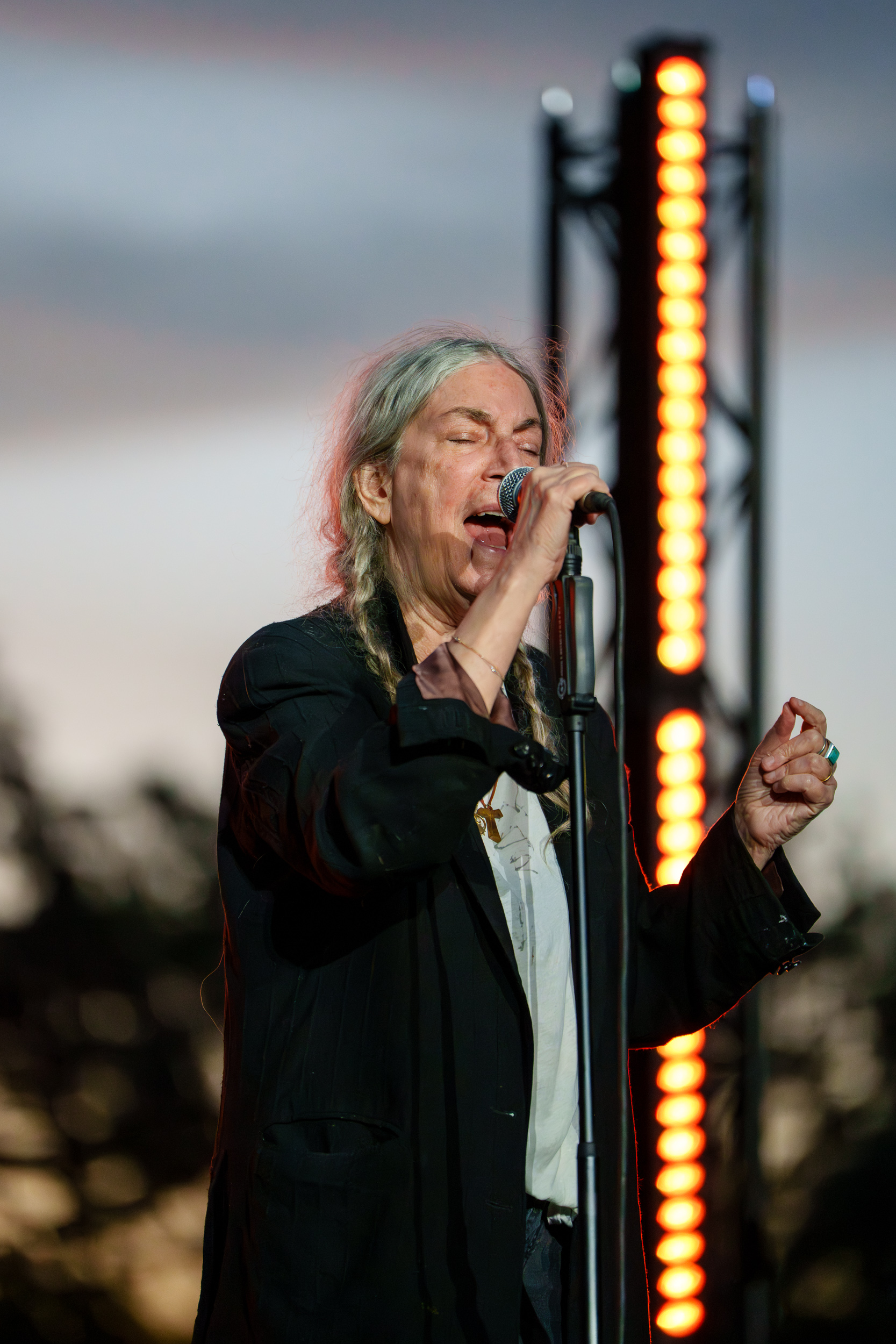 Patti Smith singing into the microphone during the Patti Smith Quartet concert at Lycabettus Theater in Athens, 2026