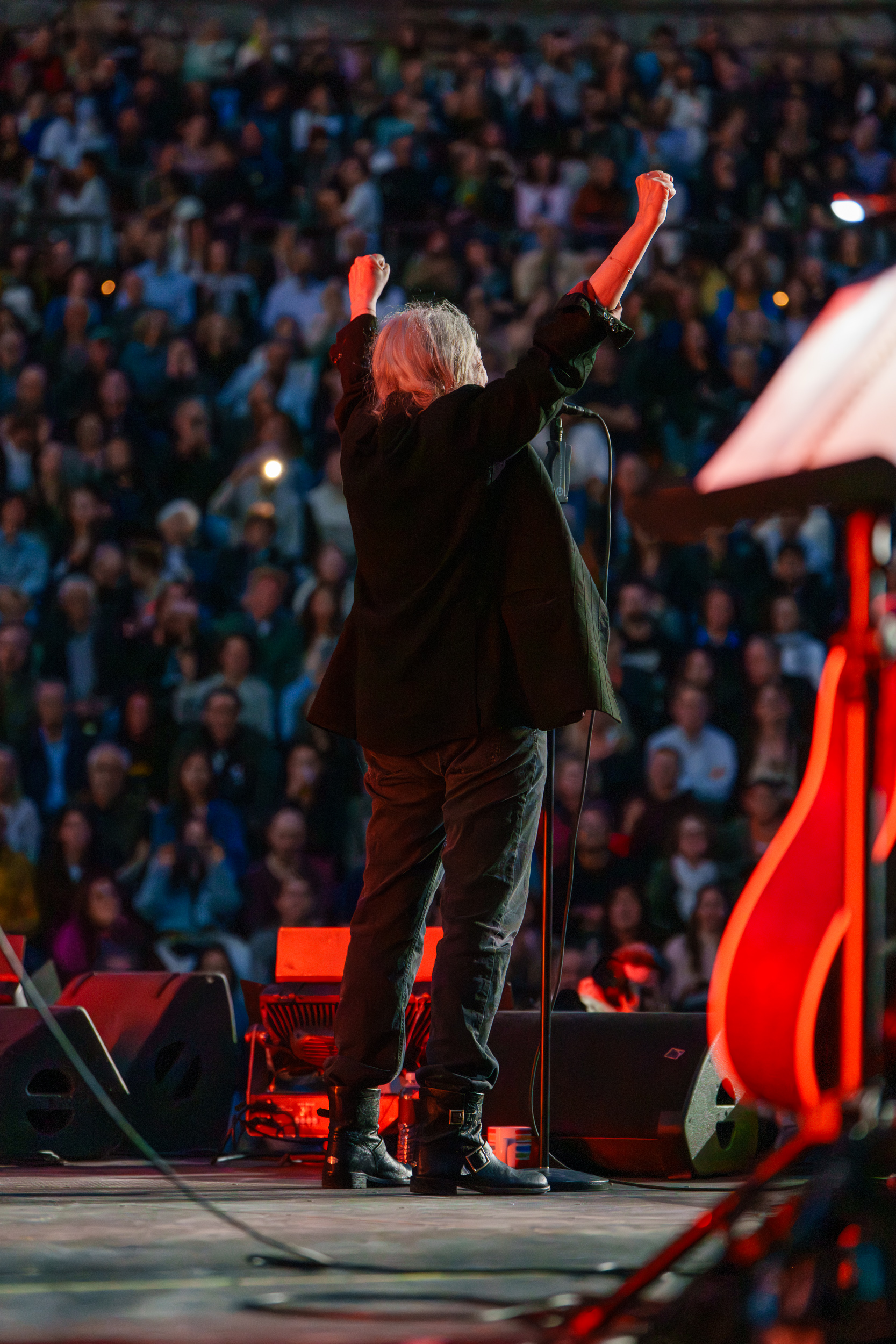 Patti Smith raising her fists toward the audience during the Patti Smith Quartet concert at Lycabettus Theater in Athens, 2026