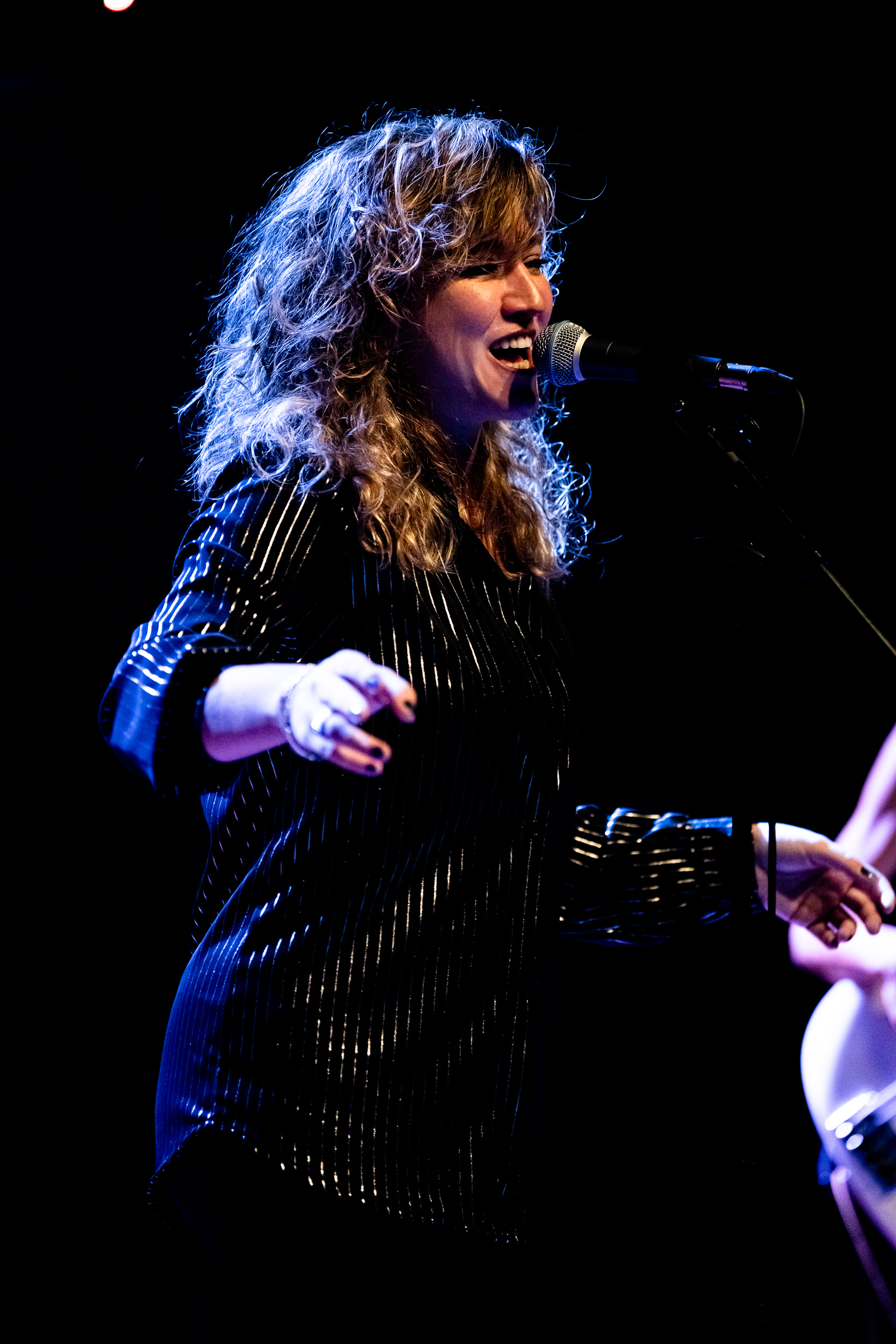 Chrysi, vocalist of Secular Upheaval, performing live at Architektoniki in Athens in 2025.