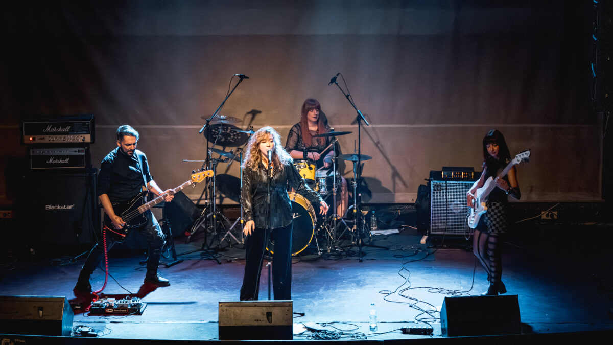 Secular Upheaval performing live at Architektoniki in Athens in 2025, featuring vocals, two bass guitars and drums.