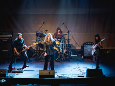 Secular Upheaval performing live at Architektoniki in Athens in 2025, featuring vocals, two bass guitars and drums.